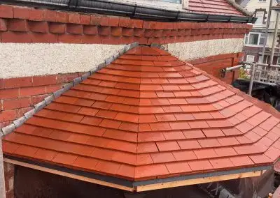 Completed red tiled roof on a residential property